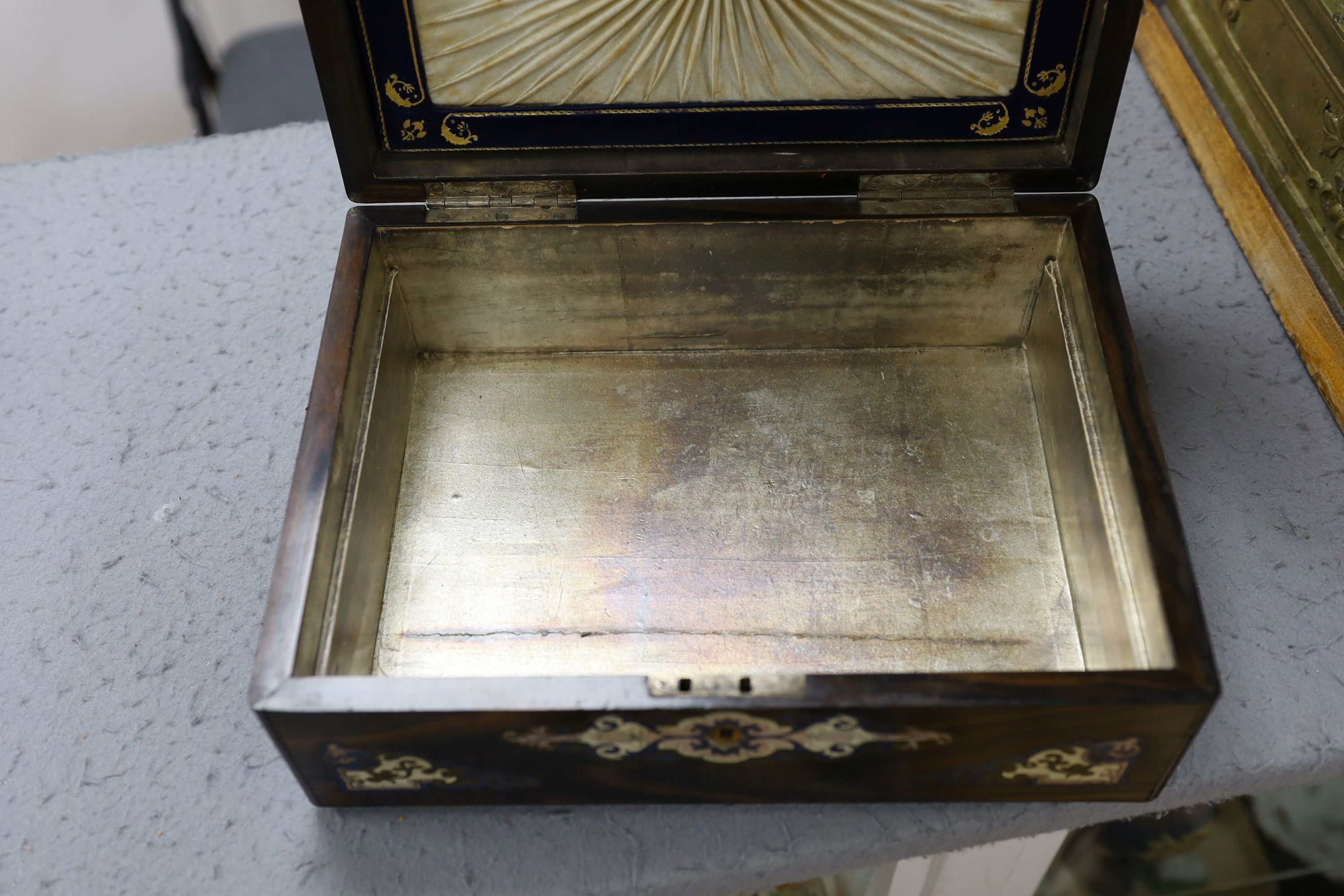 A French rosewood brass inlay and enamelled box, interior missing, 31 cms wide x 12 cms high